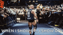 a wrestler with bullet proof on his back walks into a crowd