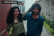 a man and a woman are standing next to each other with a 7wick reddy logo in the corner