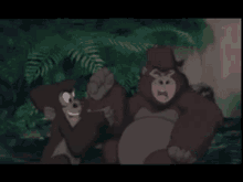 two cartoon gorillas are standing next to each other in the jungle