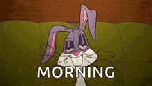 bugs bunny is laying on a couch with his eyes closed and the words morning written below him .