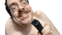 a shirtless man with glasses is holding a black clipper