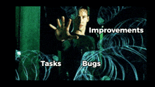 a man is surrounded by glowing lines and the words tasks and bugs are on the screen