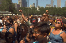 a crowd of people at a festival with a man wearing a bandana that says ' i love you ' on it