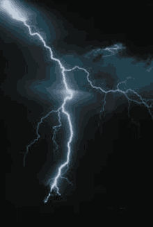 a close up of a lightning bolt in the dark sky .