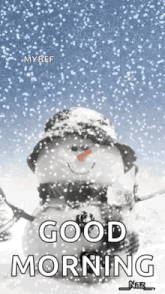 a snowman with a hat and scarf is sitting in the snow .