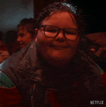 a close up of a person 's face with a netflix logo on the bottom
