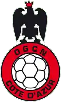 a logo for ogcn cote d' azur with a soccer ball in the center