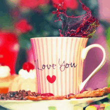 a cup that says i love you with a red heart