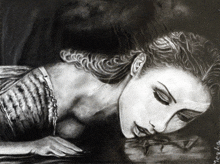 a black and white drawing of a woman laying on the ground