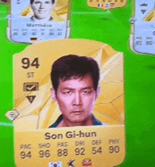 a son gi-hun card is on a green field