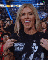 a woman is wearing a t-shirt that says netflix on the front