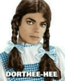 michael jackson is dressed as a girl from the wizard of oz with pigtails and a blue dress .