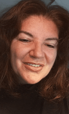 a close up of a woman 's face with long hair