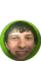 a man with curly hair is smiling in a green circle .