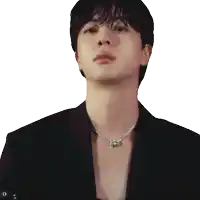 a close up of a man wearing a necklace and a jacket
