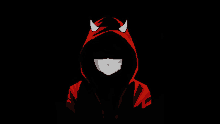 a person wearing a red devil hoodie with horns