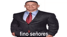 a man in a suit and tie is standing in front of a white background with the words fino señores .