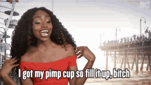 a woman in a red off the shoulder top says i got my pimp cup so fill it up bitch