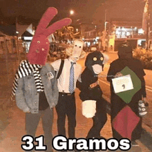 a group of people dressed up in costumes are standing next to each other on a sidewalk .