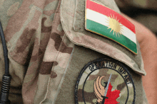 a patch on a soldier 's shoulder says operation impact