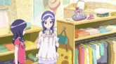 a girl with purple hair is standing next to another girl in a store