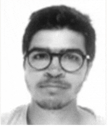 a black and white photo of a man with glasses