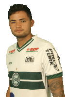 a man wearing a white and green shirt with rdp and gt logos on the sleeves