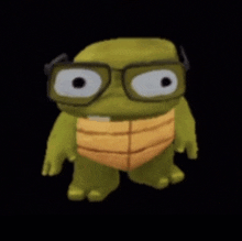 a stuffed green turtle wearing glasses and a yellow shell