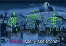 a group of glow in the dark skeletons are dancing in a cemetery at night .