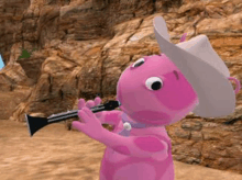 a pink cartoon character is playing a clarinet while wearing a cowboy hat .