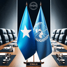 a conference table with two flags on it and a sign that says somalia