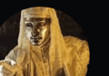 a close up of a statue of a man wearing a white robe and a hat .