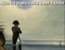 a painting of napoleon looking at the ocean with a caption that says não ha mais nada a ser fazido .