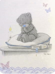 a drawing of a teddy bear sitting on a pillow next to a book