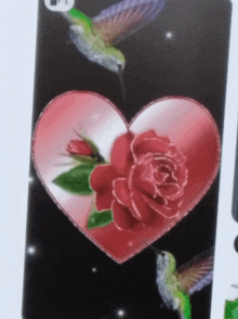 a playing card with a heart with a rose and hummingbirds