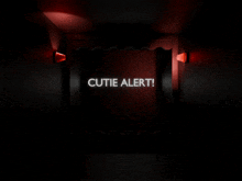 a sign that says cutie alert is lit up in the dark