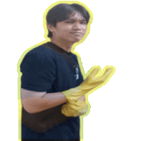 a man wearing a black shirt and yellow gloves applauds