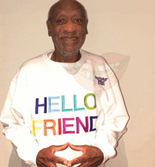 a man is wearing a white sweatshirt that says hello friend