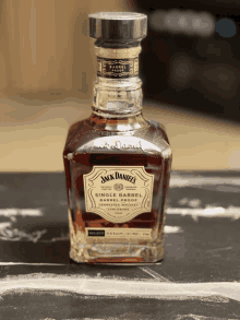 a bottle of jack daniel 's single barrel sitting on a table