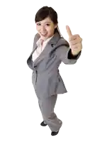 a woman in a suit gives a thumbs up