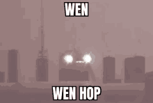 a truck is driving through a foggy area with the words wen wen hop written on the bottom .