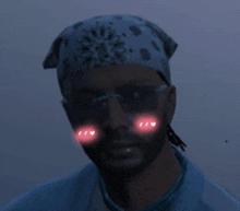 a man wearing sunglasses , a bandana and a headband with hearts on his face .