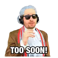 a man wearing a wig and sunglasses has the words too soon written on his face