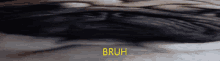 a close up of a person 's face with the word bruh on the bottom right