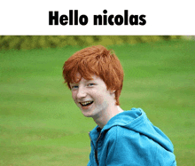 a picture of a boy with red hair and the words hello nicolas