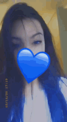 a girl with a blue heart on her face taken on 03/15/20