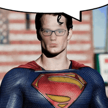 a man in a superman costume has glasses on