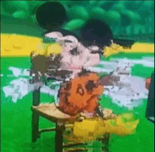 mickey mouse is sitting on a chair with a gun in his hand .