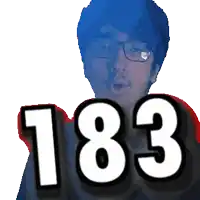 a man with glasses holds up the number 183 in front of his face