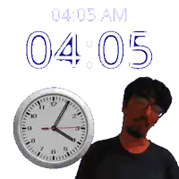 a man is standing in front of a clock that says 4:05 am